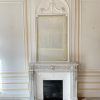 ( Réservée)Belle cheminée ancienne de style Louis XVI a décors de postes ,rosaces et acanthes réalisée en marbre Blanc de Carrare datant de la fin du XIXème siècle
